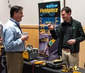 Daniel Blosser talking with Fieldpiece vendor at the RBI 2022 Service Team Appreciation Breakfast