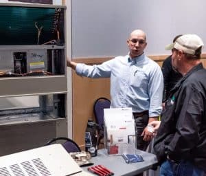 vendor talking with employee at the RBI 2022 Service Team Appreciation Breakfast