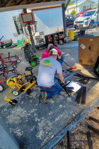 RBI employees putting together equipment at Roberta Webb Childcare Center for United Way's Day of Action