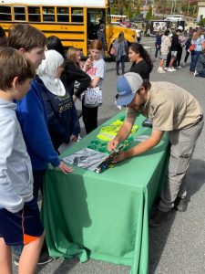 RBI staff at William Monroe High School career fair with young students.