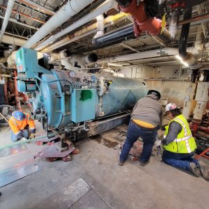 RBI employees removing a boiler from a commercial building.