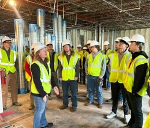 Students touring an in-progress facility