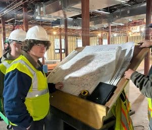Students touring an in-progress facility