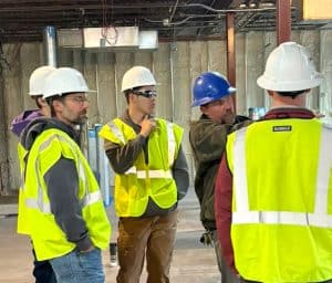Students touring an in-progress facility