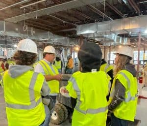 Students touring an in-progress facility