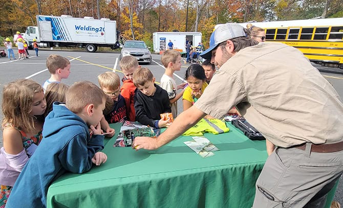 RBI-About-Community-2023-Greene-Co-Career-Day RBI outside at a career day with students