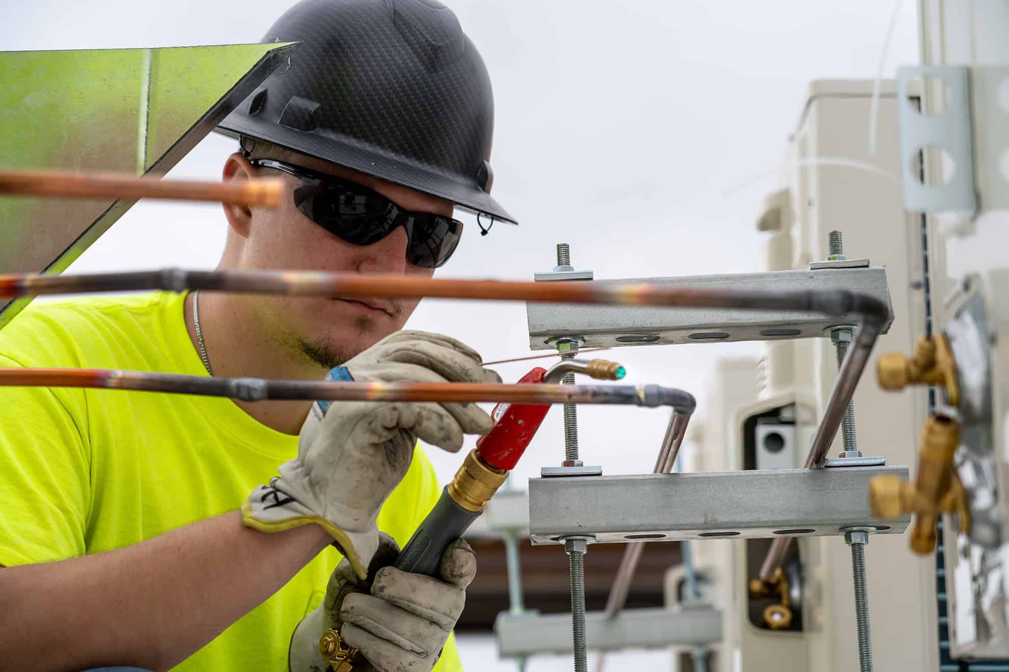 Close up of RBI technician installing HVAC systems