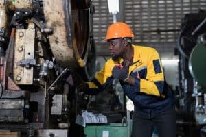 A technician inspecting a large air handler