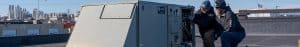 RBI service technicians inspecting a rooftop HVAC unit